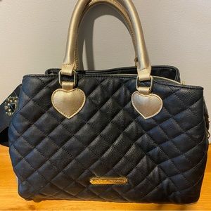 Almost brand new Betsey Johnson Purse black and gold beautiful shape.